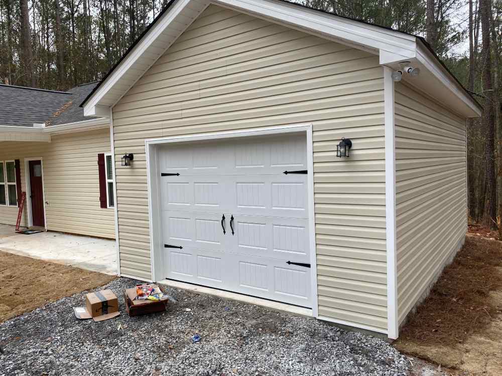 Installing new garage door on new construction in Thomaston