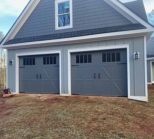  Two sets of blue double door garages